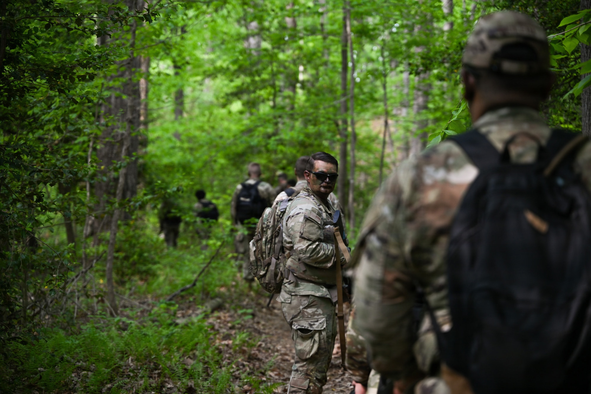 U.S. Air Force Senior Airman Robert Otto, 89th Aerial Port Squadron air transportation senior controller, scopes the environment during a mission at the field training exercise at Marine Corps Base Quantico, Virginia, April 24, 2026.