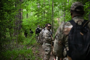 U.S. Air Force Senior Airman Robert Otto, 89th Aerial Port Squadron air transportation senior controller, scopes the environment during a mission at the field training exercise at Marine Corps Base Quantico, Virginia, April 24, 2026.