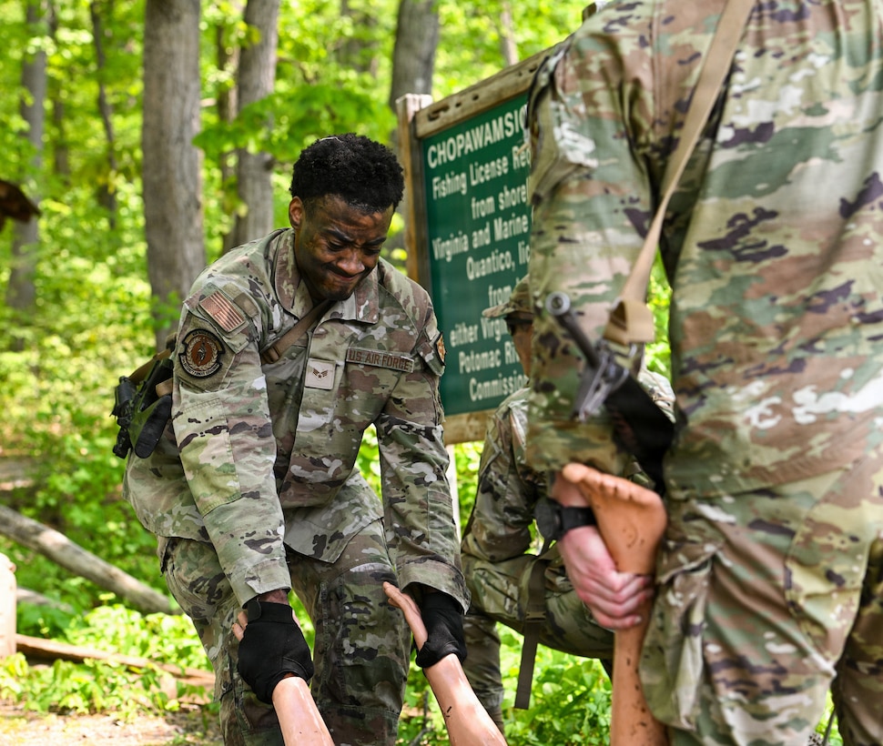 U.S. Air Force Senior Airman Ryan Taylor, 316th Wing Security Forces Squadron base defense operation center controller, practices a water rescue during a field training exercise at Marine Corps Base Quantico, Virginia, April 24, 2026.