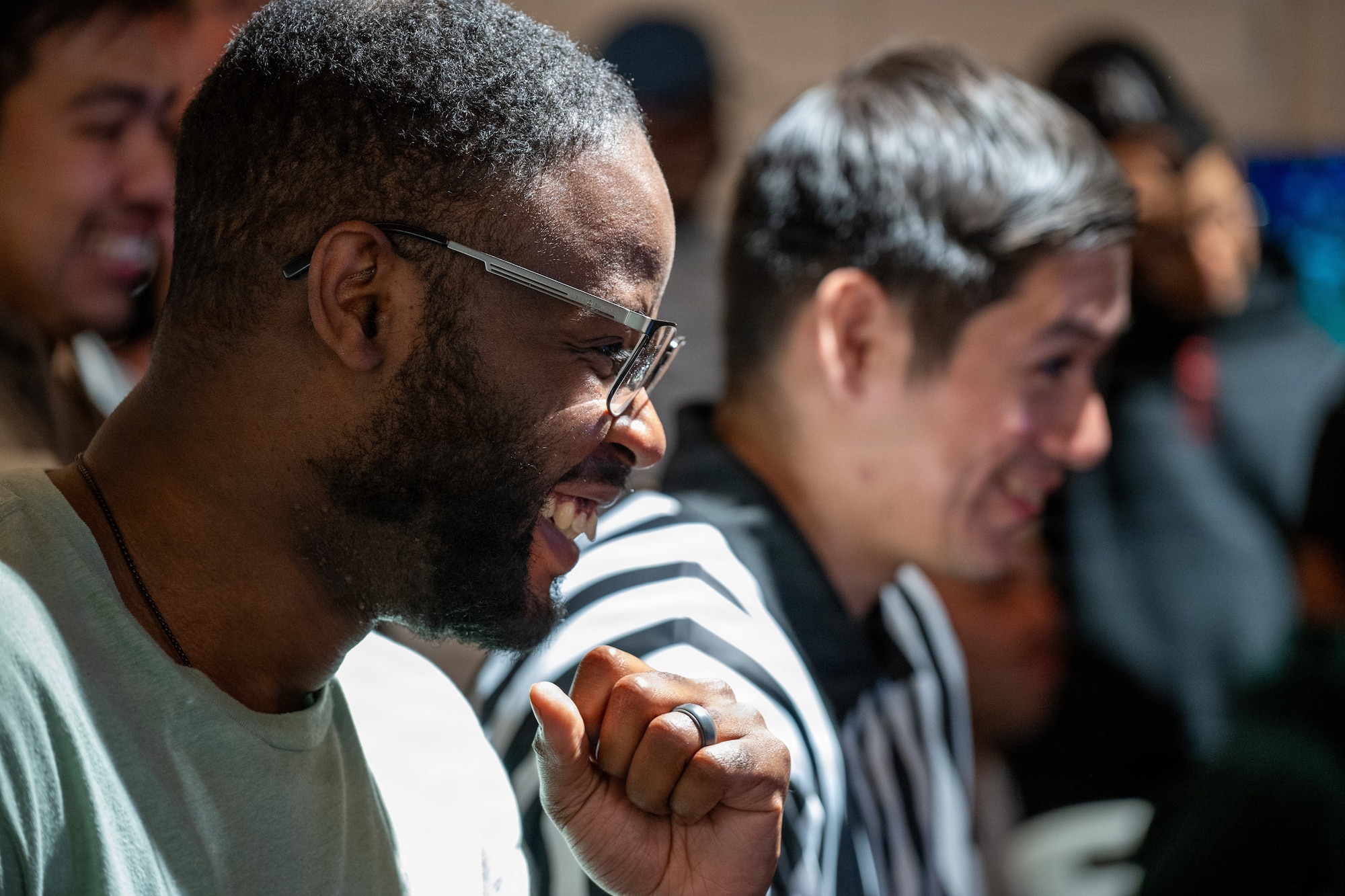 U.S. Air Force Master Sgt. Keshawn Lipscomb, 501st Combat Support Wing executive assistant to the command chief, reacts during a gaming tournament
