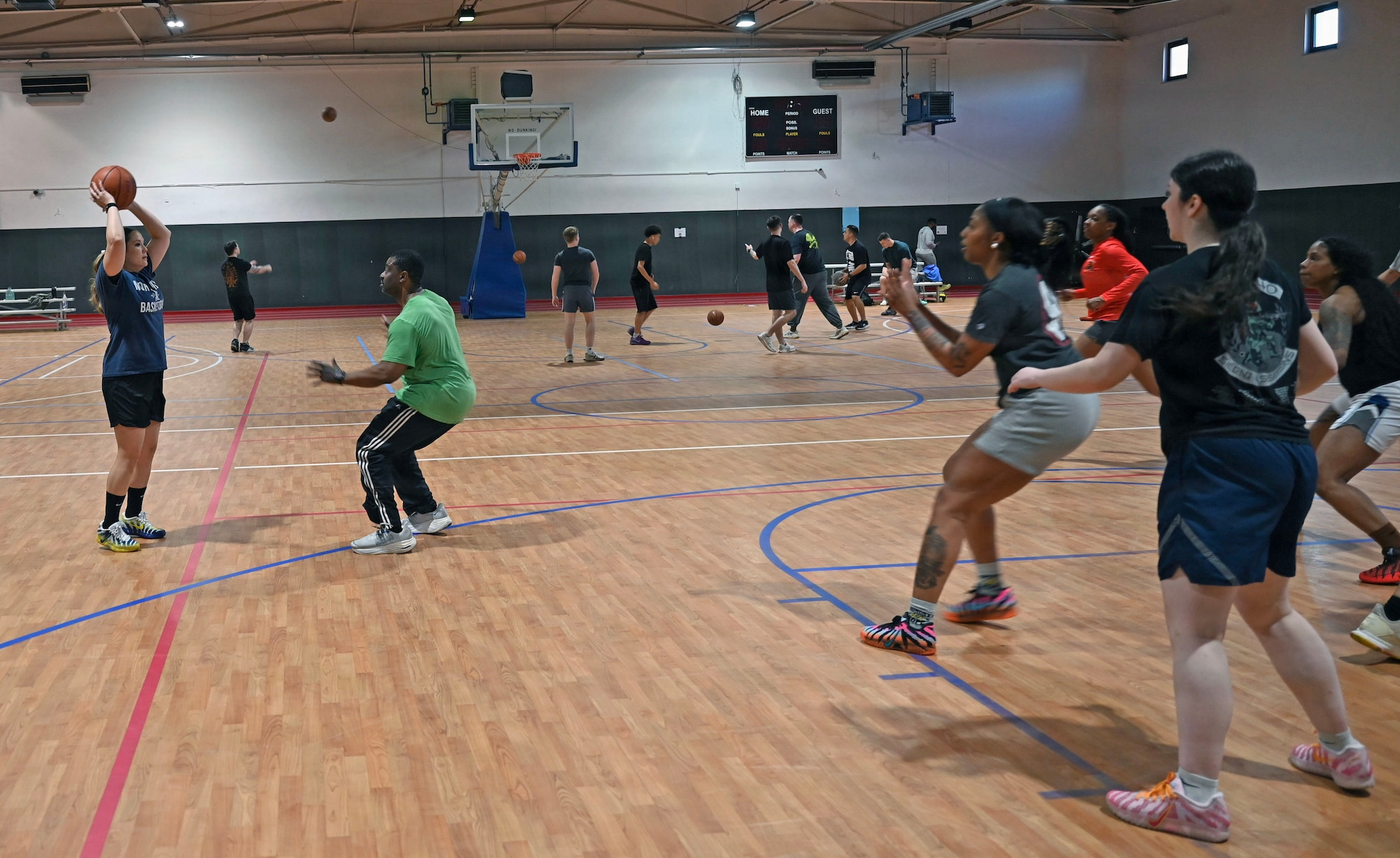 women participate in basketball game