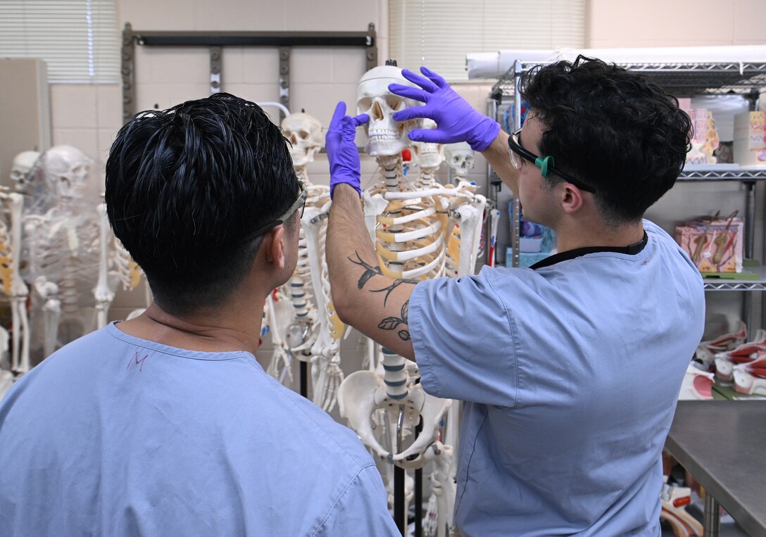 An instructor from the Joint Special Operations Medical Training Center at the U.S. Army John F. Kennedy Special Warfare Center and School provides instruction to students in the Special Operations Combat Medic Course on the human skeletal and muscular system during training at Fort Bragg, North Carolina May 1, 2025. Enlisted service members who completed the course specialize in trauma management, infectious diseases, cardiac life support and surgical procedures and qualify as highly trained combat medics with the skills necessary to provide initial medical and trauma care and to sustain a casualty for up to 72 hours. (U.S. Army photo by K. Kassens)