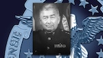 Graphic featuring an official photo of a man in a Marine Corps dress uniform