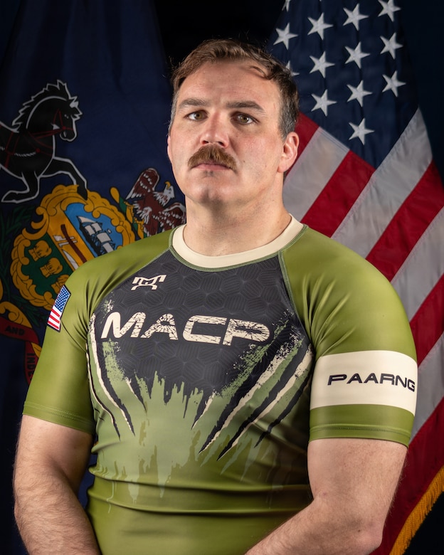 Army National Guard Combatives team member Staff Sgt. Alexander G. Myers, a combat engineer with the Combat Engineer Company - Infantry, 56th Mobile Brigade Combat Team, 28th Infantry Division, Pennsylvania National Guard, poses for a portrait ahead of the 2026 Army Lacerda Cup (All-Army Combatives Championship) taking place at Fort Benning, Georgia, April 7, 2026. 



"I look forward to having the opportunity to compete," he said.



An Army National Guard team, comprised of Pennsylvania, Ohio, and District of Columbia National Guardsmen, have just finished their two-week training camp at Fort Indiantown Gap, Pennsylvania, and will now be moving into their week of assessment before heading to the championship tournament.



(U.S. Army National Guard photo by Sgt. Tristan Murry)