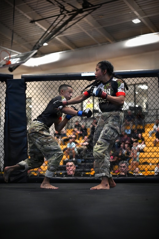 U.S. Army Spc. Isaiah Castellanos (left), District of Columbia National Guard, and Spc. Sandra Chheng, Pennsylvania Army National Guard, compete in the bantamweight finals during day three of the 2026 Lacerda Cup All-Army Combatives Championship at Fort Benning, Ga. Apr. 10, 2026. The two Army National Guard teams finished the tournament with third and sixth place team standings out of twenty-one teams competing, with three National Guard Soldiers earning championship belts. (U.S. Army National Guard photo by Sgt. 1st Class Shane Smith)