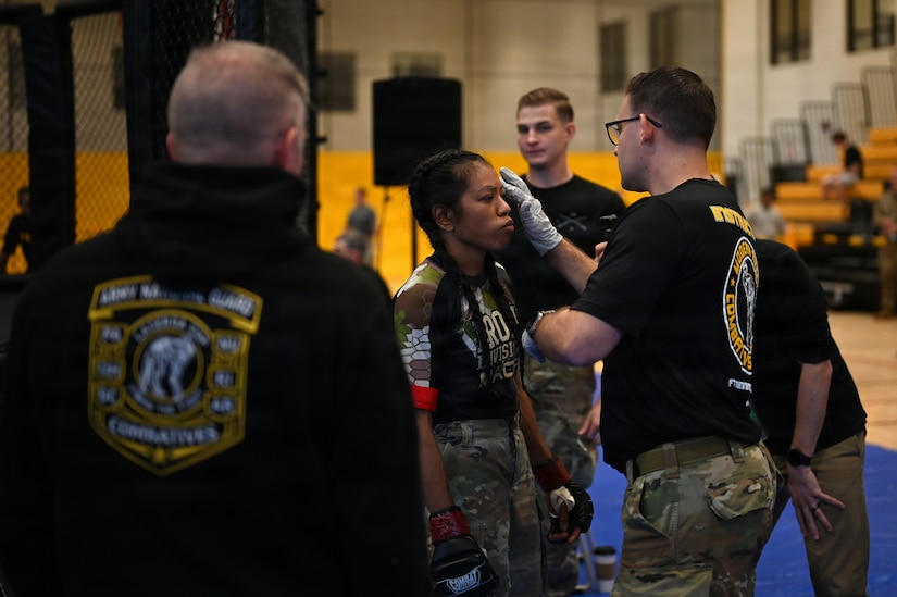 U.S. Army Spc. Sandra Chheng (center), Pennsylvania Army National Guard, competes in the heavyweight finals during day three of the 2026 Lacerda Cup All-Army Combatives Championship at Fort Benning, Ga. Apr. 10, 2026. The two Army National Guard teams finished the tournament with third and sixth place team standings out of twenty-one teams competing, with three National Guard Soldiers earning championship belts. (U.S. Army National Guard photo by Sgt. 1st Class Shane Smith)