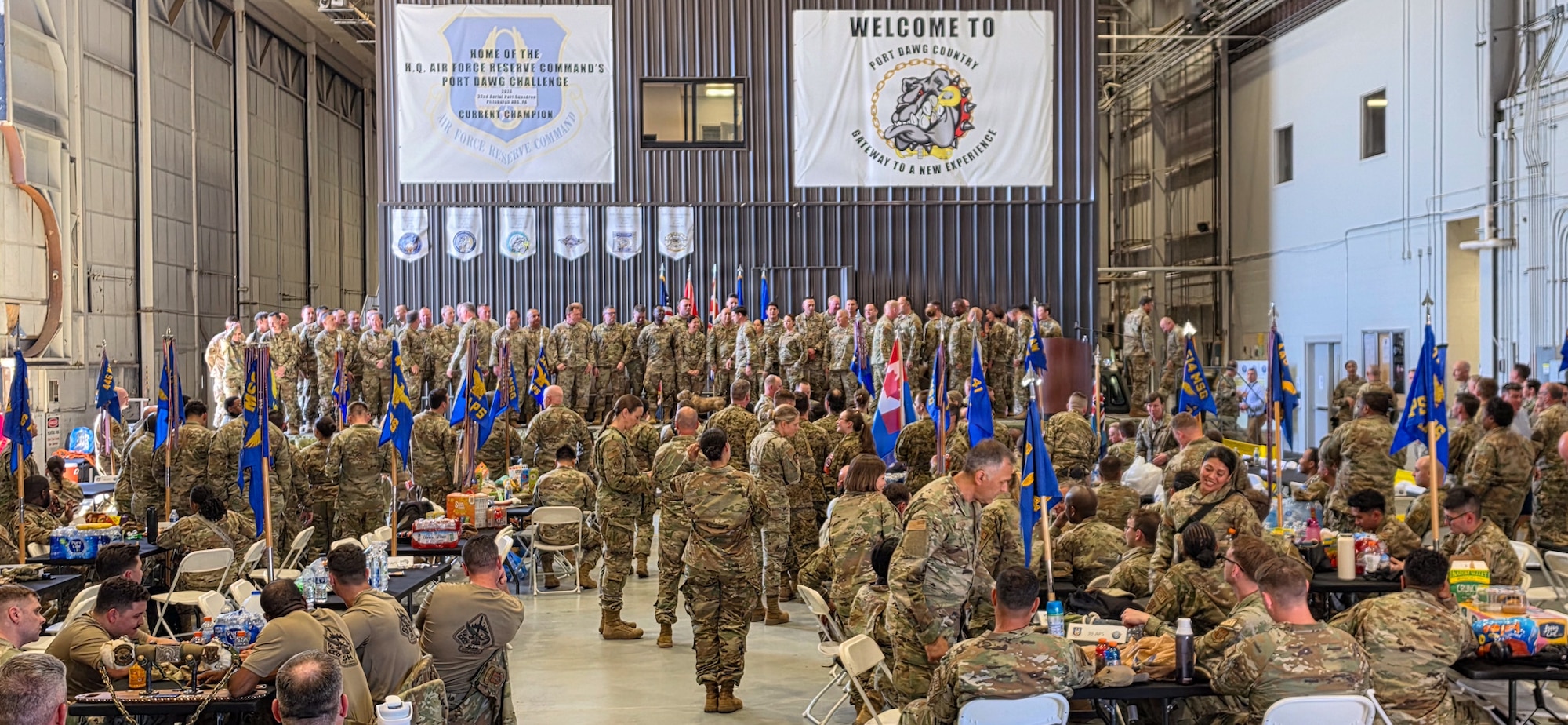 Three Airmen working on a pallet and equipment.