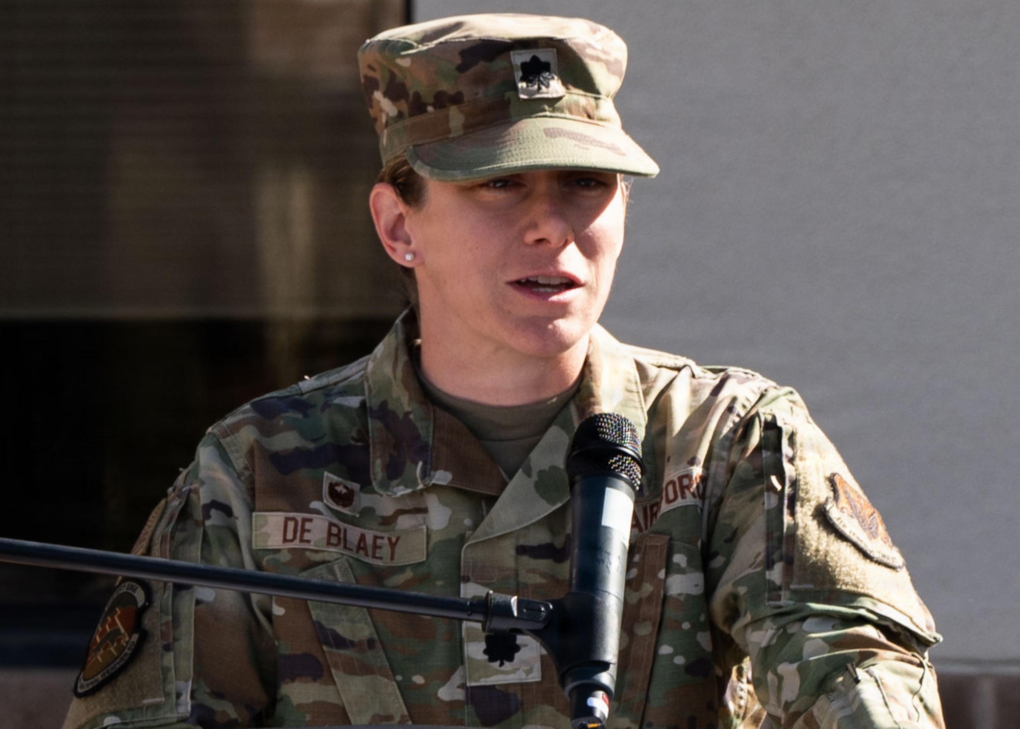 U.S. Air Force Lt. Col. Gretchen De Blaey, commander of the 25th Operational Weather Squadron, speaks to the audience during the Capt. Nathan J. Nylander Memorial Ceremony at Davis-Monthan Air Force Base, Arizona, April 24, 2026. De Blaey spoke about Nylander’s sacrifice and how the 25th OWS continues to honor his legacy. (U.S. Air Force photo by Airman Najzee Kuzu)