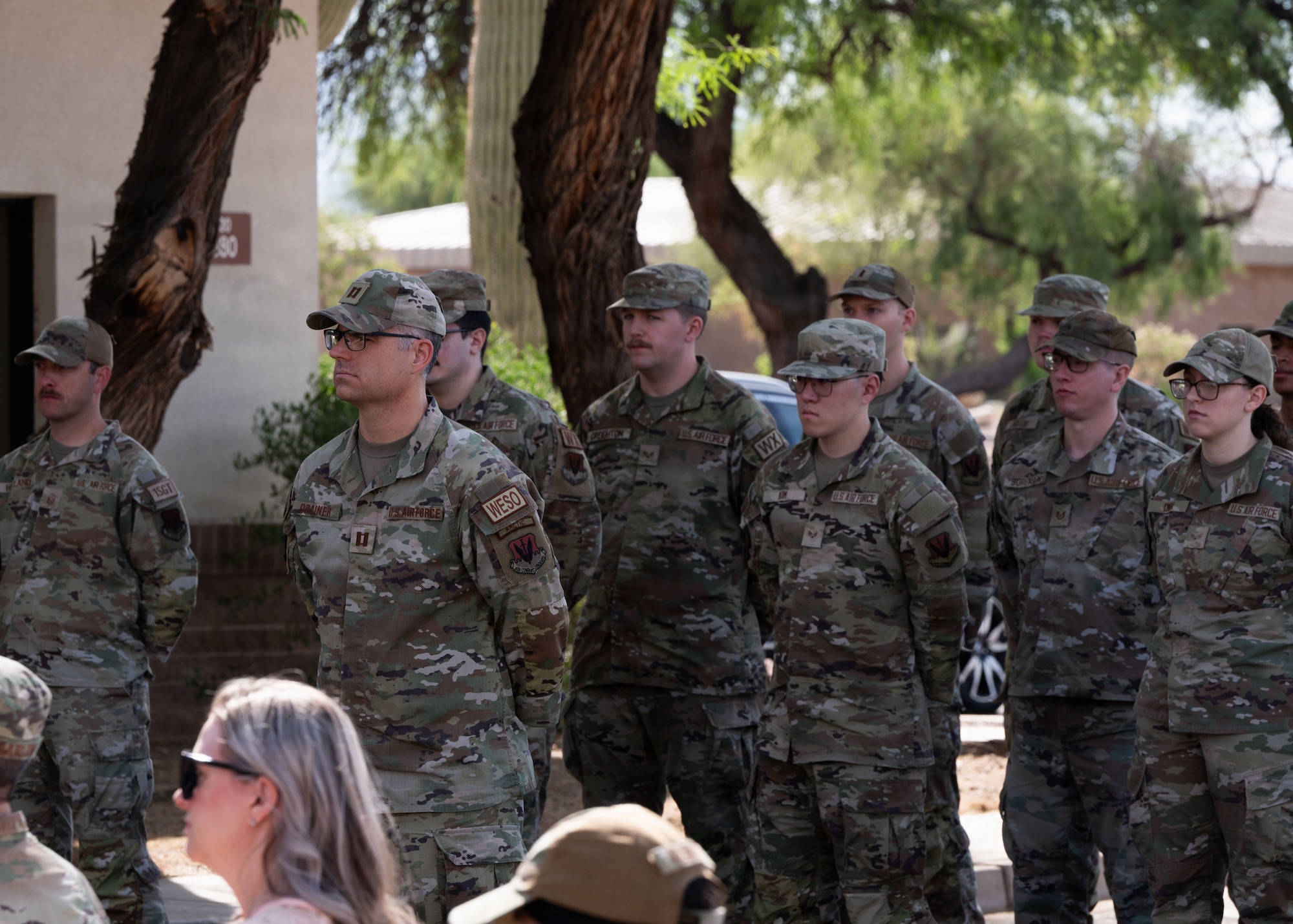 U.S. Air Force Capt. David Drainer, 25th Operational Weather Squadron X-ray flight commander, stands in attendance with Airmen assigned to the 25th OWS during the Capt. Nathan J. Nylander Memorial Ceremony at Davis-Monthan Air Force Base, Arizona, April 24, 2026. The ceremony honored Capt. Nathan J. Nylander and his selfless sacrifice in service to his country. (U.S. Air Force photo by Airman Najzee Kuzu)