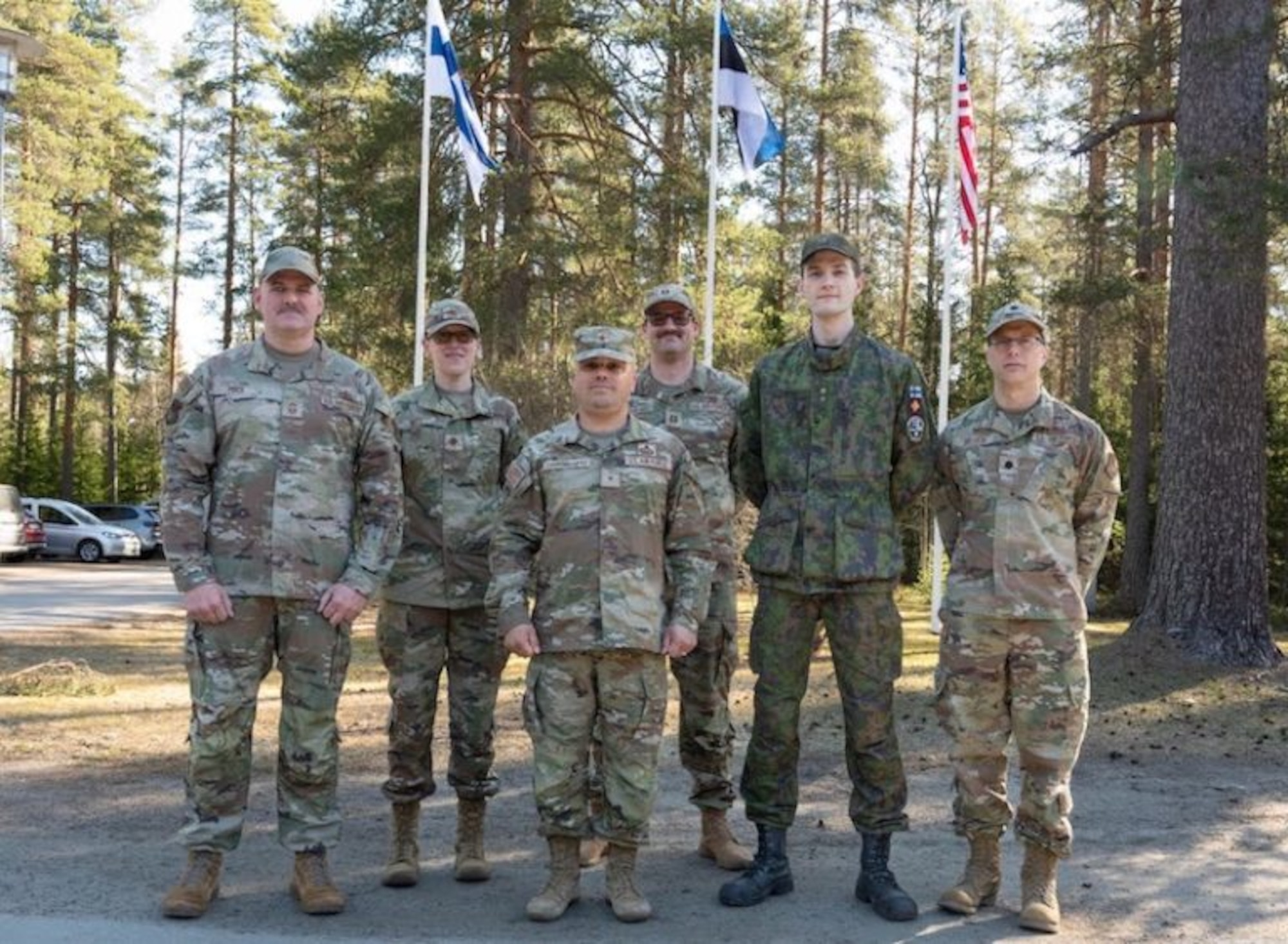 Maryland Air National Guard Brig. Gen. Joed Carbonell-López, 175th Wing commander, center, Chief Master Sgt. Shane A. Price, Maryland Air National Guard state command chief, far left, and Maryland support staff stand together with Finnish Defense Forces Lt. Joona Vainio, staff officer, center right, during their visit to NATO Exercise Locked Shields 26 in central Finland, April 21, 2026.