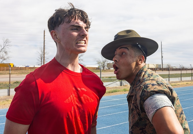 U.S Marine Corps Sgt. Armando Perez, a drill instructor with Marine Corps Recruit Depot San Diego, instructs a poolee during Recruiting Station Denver's annual pool function at Buckley Space Force Base in Aurora, Colorado, April 11, 2026. The annual pool function provided an opportunity for future Marines to build camaraderie, strengthen their commitment to the Marine Corps, and prepare for recruit training by competing in athletic competitions and receiving military-related periods of instruction. (U.S. Marine Corps photo by Lance Cpl. Kayla Goldman)