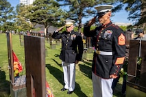 U.S. Marine Corps Maj. Darryl Gravelle, center, the Recruiting Station Oklahoma City commanding officer, and Sgt. Maj. Daniel Jacobson, right, the Recruiting Station Oklahoma City sergeant major, salute memorials to two Marines following the 31st annual remembrance ceremony at the Oklahoma City National Memorial and Museum in Oklahoma City, Oklahoma, April 19, 2026. The ceremony marks the anniversary of the bombing and honors the 168 victims, including two U.S. Marines, Capt. Randolph Guzman and Sgt. Benjamin Davis, who were serving with Recruiting Station Oklahoma City at the time of the attack. (U.S. Marine Corps photo by Staff Sgt. Lennon Dregoiw)