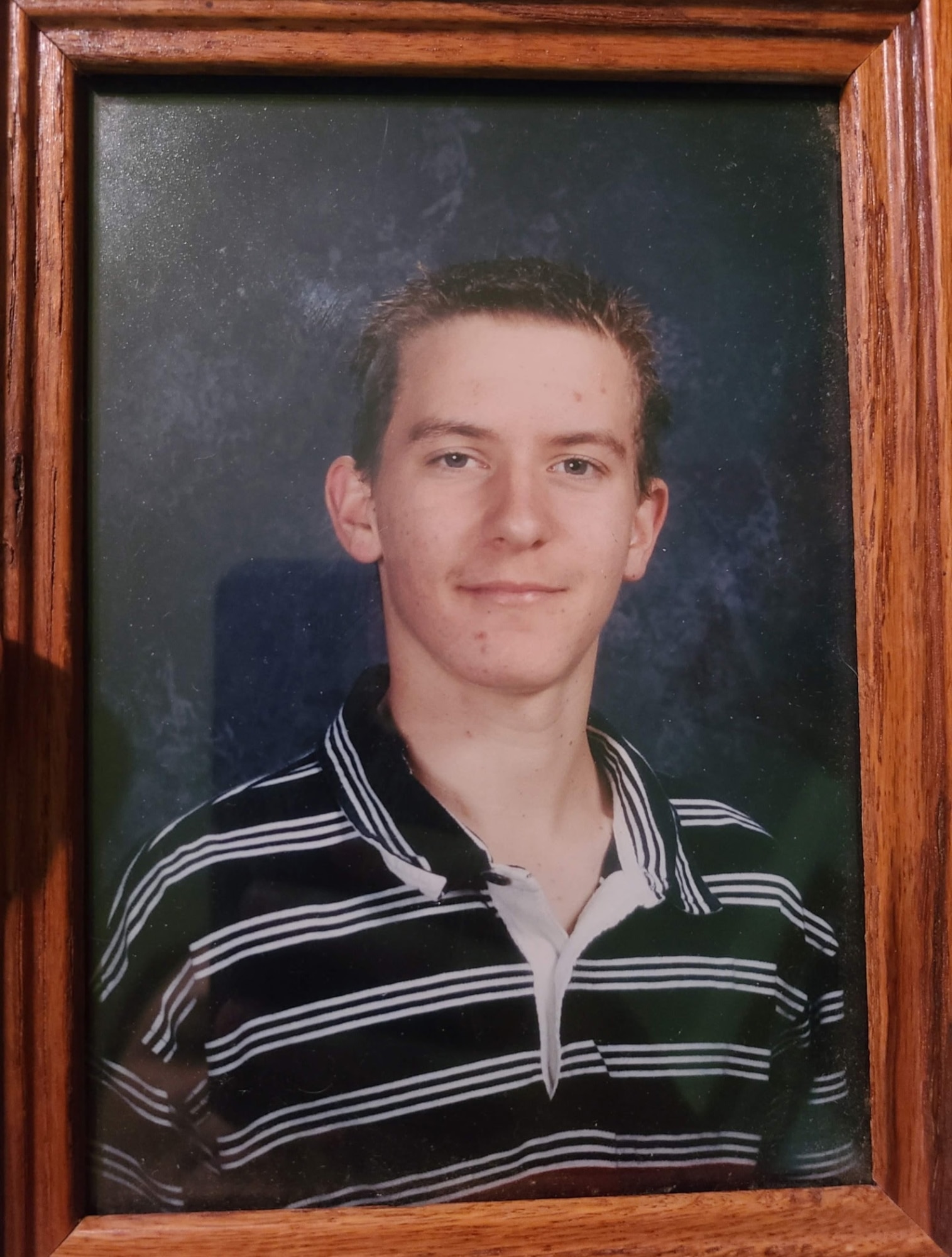 Master Sgt. Ryan Rosso, 142nd Aircraft Maintenance Squadron First Sergeant, poses for a high school photo around 20004. Rosso graduated from the Oregon Youth Challenge Program 20 years ago and returned to speak with the current high school aged students about what their future might hold.