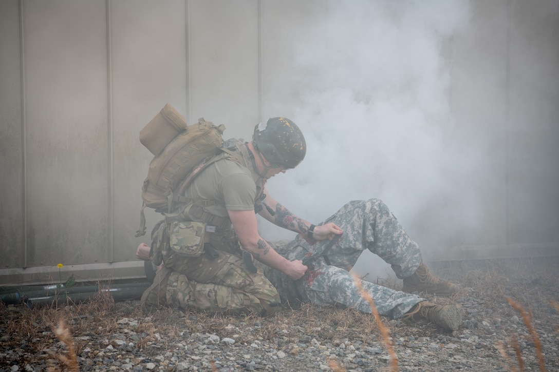 FORT BRAGG, N.C. (Feb. 16, 2023) – Students in the Special Operations Combat Medic Course at the U.S. Army John F. Kennedy Special Warfare Center and School simulate casualty care with high fidelity manikins and using hyper realistic special effects makeup called moulage during training at Fort Bragg, North Carolina Feb. 16, 2023. NSOMI, a detachment of NMOTC, specializes in training the enlisted service members and medical providers who support US special operations. Enlisted service members who completed the courses will specialize in trauma management, infectious diseases, cardiac life support and surgical procedures, with a basic understanding of veterinary medicine and dental medicine. Navy Medicine Operational Training Command (NMOTC) is comprised of six nationwide detachments that offer specialized medical training in the fields of aviation, aviation survival, surface and undersea warfare, expeditionary and special operations medicine. (U.S. Navy Photo by Mass Communication Specialist 2nd Class Russell Lindsey)