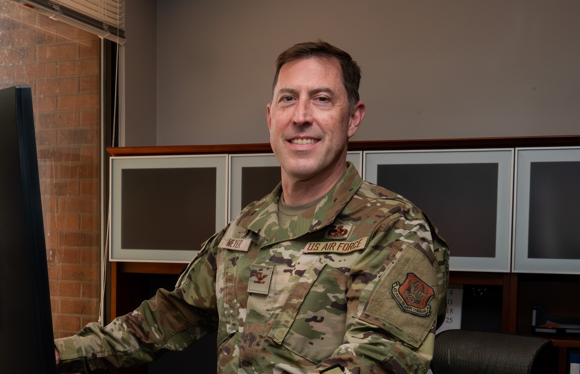 Col Meyer at his desk in his office.