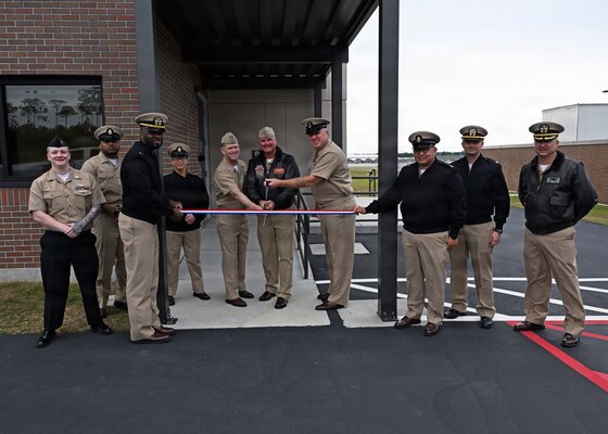 Leadership from across Naval Air Station Whiting Field and Training Air Wing Five gather to cut the ribbon for the installation’s new air traffic control tower April 6, 2026.  The new tower will directly support T-6 Texan II flight operations, increasing air traffic control capabilities. NAS Whiting Field plays a critical role in producing mission-ready aviators who support the national defense of our nation, delivering high-quality flight training while reinforcing its commitment to operational excellence. (U.S. Navy photo by Christy Mason)