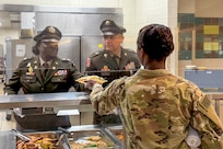 Lt. Col. Kemetta G. Burdette, left, Commander, 1-347th Training Support Battalion, and Command Sgt. Maj. Eduardo Amesquita, Command Sergeant Major, 1-347th TSBN, serve food at the North Fort Hood Dining Facility on April 23, 2026, as part of the U.S. Army Reserve's 118th birthday celebration.
