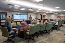 Photo of cadets briefing in a conference room