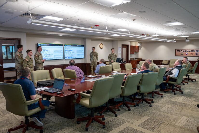Photo of cadets briefing in a conference room