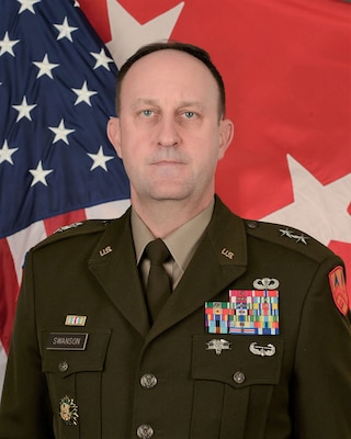 Maj. Gen. Justin Swanson, 377th Theater Sustainment Command, Commanding General, sits for official photo