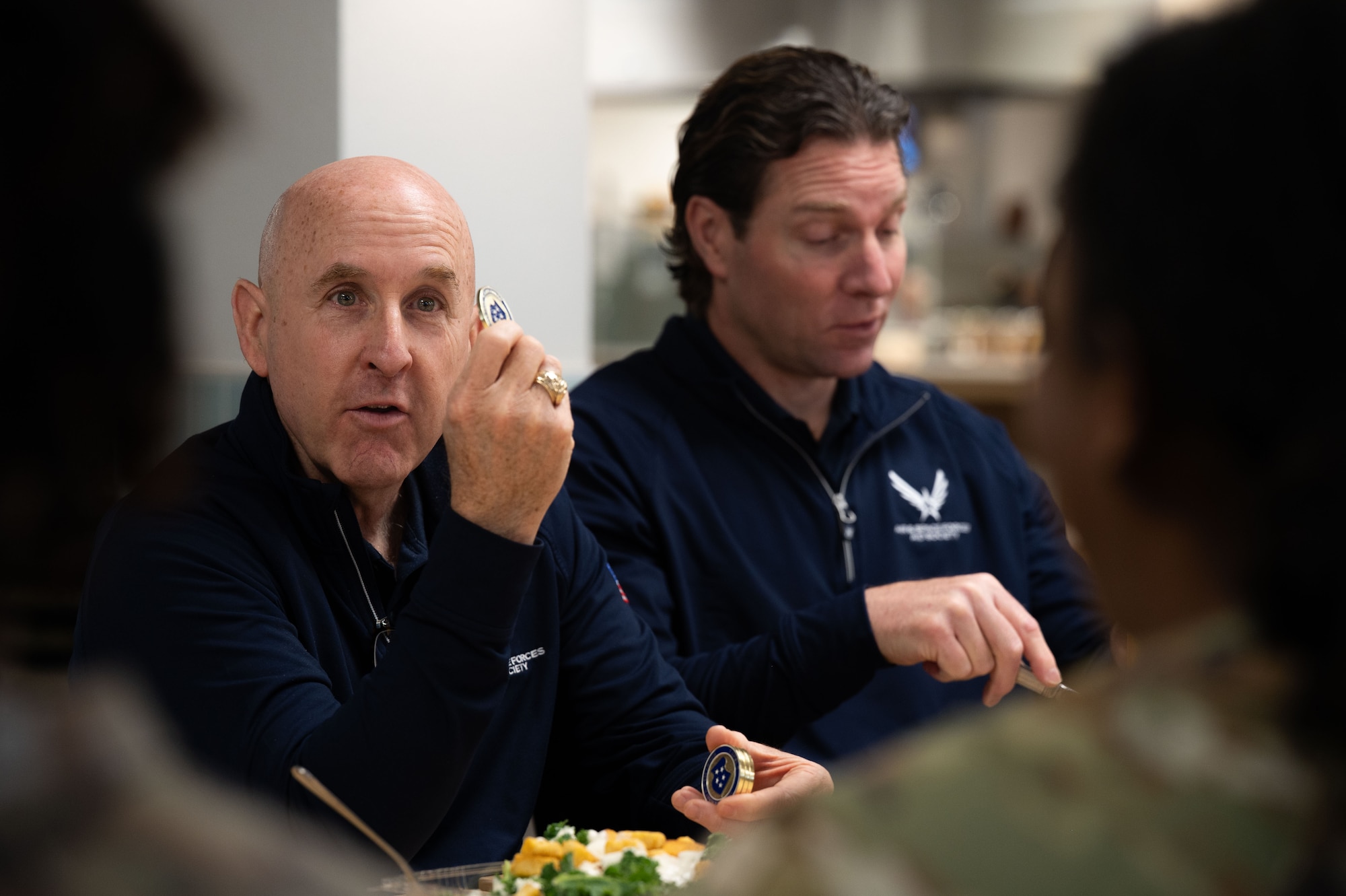 U.S. Air Force retired Maj. Gen. Ed Thomas, retired, Air and Space Forces Aid Society chief executive officer, left, and Packy Lyden, AFAS chief development officer, right, meet with the 355th Wing Chapel Team to discuss AFAS programs at Davis-Monthan Air Force Base, Arizona, April 29, 2026,. AFAS provides financial assistance and support services to Airmen and their families during times of need. (U.S. Air Force photo by Airman 1st Class Jaden Kidd)