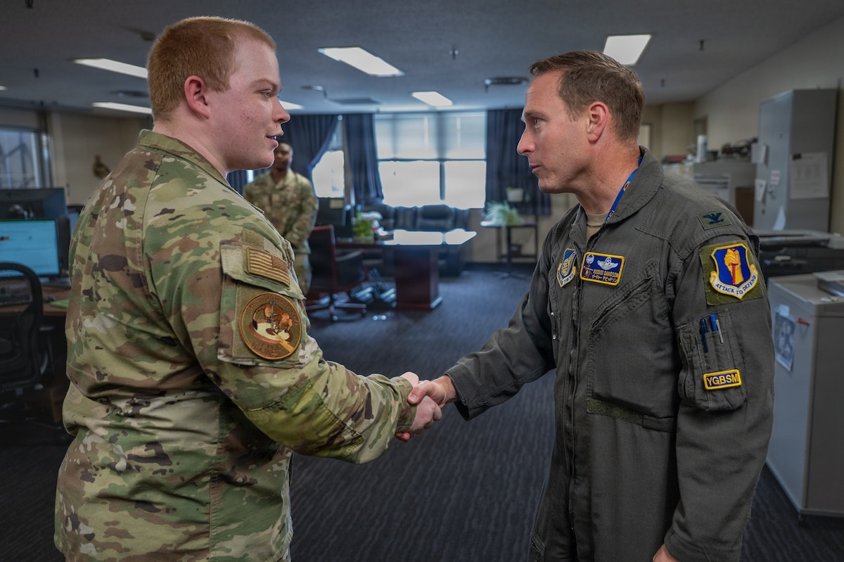 U.S. Air Force Airman 1st Class Zachary Wilkinson, 35th Logistics Readiness Squadron fleet management and analysis technician, concludes a Wild Weasel-walkthrough with Col. Paul Davidson, 35th Fighter Wing commander, at Misawa Air Base, Japan, April 27, 2026. During the engagement, he discussed his role in fleet management, supporting the coordination and availability of vehicles that enable base-wide operations and mission execution. (U.S. Air Force photo by Airman 1st Class Angelica Winther)