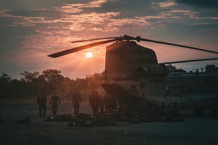 U.S. Marines, assigned to the 3rd Marine Littoral Regiment, stage gear prior to boarding a U.S. Army CH-47 Chinook helicopter, assigned to Task Force Saber, 25th Combat Aviation Brigade, 25th Infantry Division, as part of Exercise Balikatan 2026 at Cagayan North International Airport, Lal-Lo, Philippines,April 25, 2026.