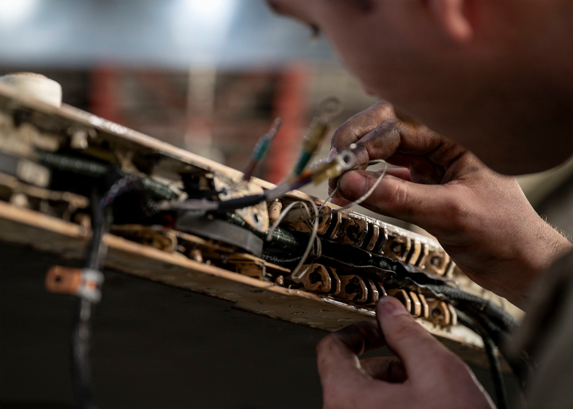 U.S. Air Force Staff Sgt. Logan Cindrich, 36th Fighter Generation Squadron weapons load crew chief, replaces an aircraft harness on an F-16 Fighting Falcon during RED FLAG-Alaska 26-1 at Eielson Air Force Base, Alaska, April 29, 2026. In addition to aircrew, RF-A provides training for deployed maintenance and support personnel in sustainment of large-force deployed air operations. (U.S. Air Force photo by Tech. Sgt. Mikaley Kline)