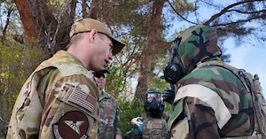 U.S. Air Force Staff Sgt. James Fink, 35th Civil Engineer Squadron emergency management noncommissioned officer in charge of logistics and training, discusses training alongside explosive ordnance disposal (EOD) Airmen.