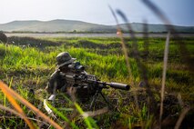 A U.S. Soldier assigned to 2nd Battalion, 21st Infantry Regiment, 3rd Mobile Brigade, 25th Infantry Division holds a security position on the airfield perimeter during Exercise Balikatan 2026 at Itbayat Airport, Itbayat, Philippines, April 24, 2026.