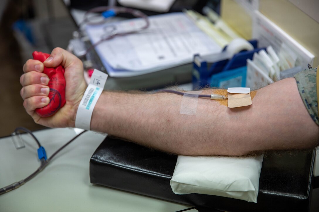 U.S. Marine Corps Sgt. Jacob Farron, a supply chain manager with Headquarters and Headquarters Squadron (HHS), Marine Corps Air Station Iwakuni, and a native of Apache Junction, Arizona, has his blood drawn during a blood drive at MCAS Iwakuni, April 23, 2026. The Japanese Red Cross and American Red Cross worked together to conduct a bi-annual blood drive to restock blood reserves. (U.S. Marine Corps photo by Lance Cpl. Rylan Adcock)