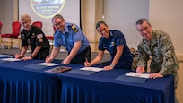 Vice Adm. Doug Perry, commander, U.S. 2nd Fleet, alongside U.S. Coast Guard, Royal Canadian Navy, and Royal Canadian Coast Guard leaders sign a maritime security agreement during the Atlantic Maritime Security Coalition (AMSC) final planning conference at Vista Point on Naval Station Norfolk, April 28, 2026.