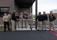 Leadership from across Naval Air Station Whiting Field and Training Air Wing Five gather to cut the ribbon for the installation’s new air traffic control tower April 6, 2026.  The new tower will directly support T-6 Texan II flight operations, increasing air traffic control capabilities. NAS Whiting Field plays a critical role in producing mission-ready aviators who support the national defense of our nation, delivering high-quality flight training while reinforcing its commitment to operational excellence. (U.S. Navy photo by Christy Mason)