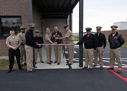 Leadership from across Naval Air Station Whiting Field and Training Air Wing Five gather to cut the ribbon for the installation’s new air traffic control tower April 6, 2026.  The new tower will directly support T-6 Texan II flight operations, increasing air traffic control capabilities. NAS Whiting Field plays a critical role in producing mission-ready aviators who support the national defense of our nation, delivering high-quality flight training while reinforcing its commitment to operational excellence. (U.S. Navy photo by Christy Mason)