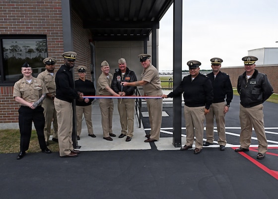 Leadership from across Naval Air Station Whiting Field and Training Air Wing Five gather to cut the ribbon for the installation’s new air traffic control tower April 6, 2026.  The new tower will directly support T-6 Texan II flight operations, increasing air traffic control capabilities. NAS Whiting Field plays a critical role in producing mission-ready aviators who support the national defense of our nation, delivering high-quality flight training while reinforcing its commitment to operational excellence. (U.S. Navy photo by Christy Mason)