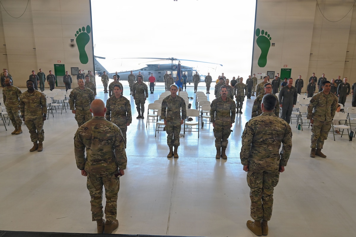 Airmen assigned to the 563d Rescue Group recite the combat search and rescue creed, led by Col. Jose Cabrera, 355th Wing commander, during a Presidential Unit Citation ceremony at Davis-Monthan Air Force Base, Arizona, April 17, 2026. The creed honored the contributions of the 66th and 58th Rescue Squadrons during the final withdrawal of U.S. troops from Afghanistan, which resulted in the evacuation of thousands of American citizens and Afghan refugees between July 16 and Aug. 31, 2021. (U.S. Air Force photo by Staff Sgt. Kahdija Slaughter)