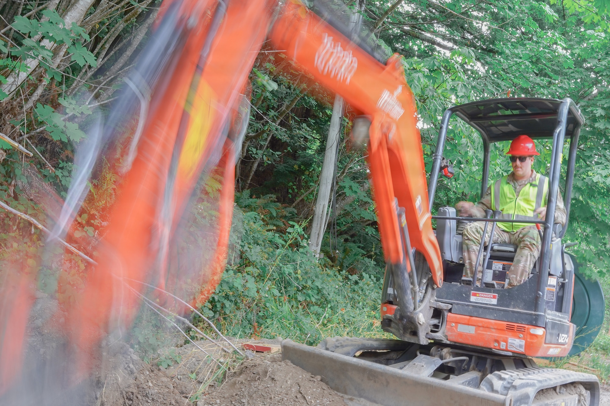 U.S. Air Force Staff Sgt. John Grumell, assigned to the 201st Rapid Engineer Deployable Heavy Operational Repair Squadron Engineers, Pennsylvania Air National Guard, excavates a trench for a culvert at Redwood National and State Parks near Orick, California, July 15, 2026.