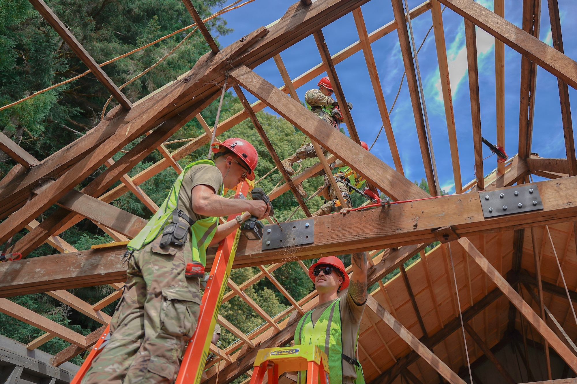 U.S. Air Force Airman, assigned to the 201st Rapid Engineer Deployable Heavy Operational Repair Squadron Engineers, Pennsylvania Air National Guard, install reinforcement plates on roof trusses at Redwood National and State Parks near Orick, California, July 14, 2026.