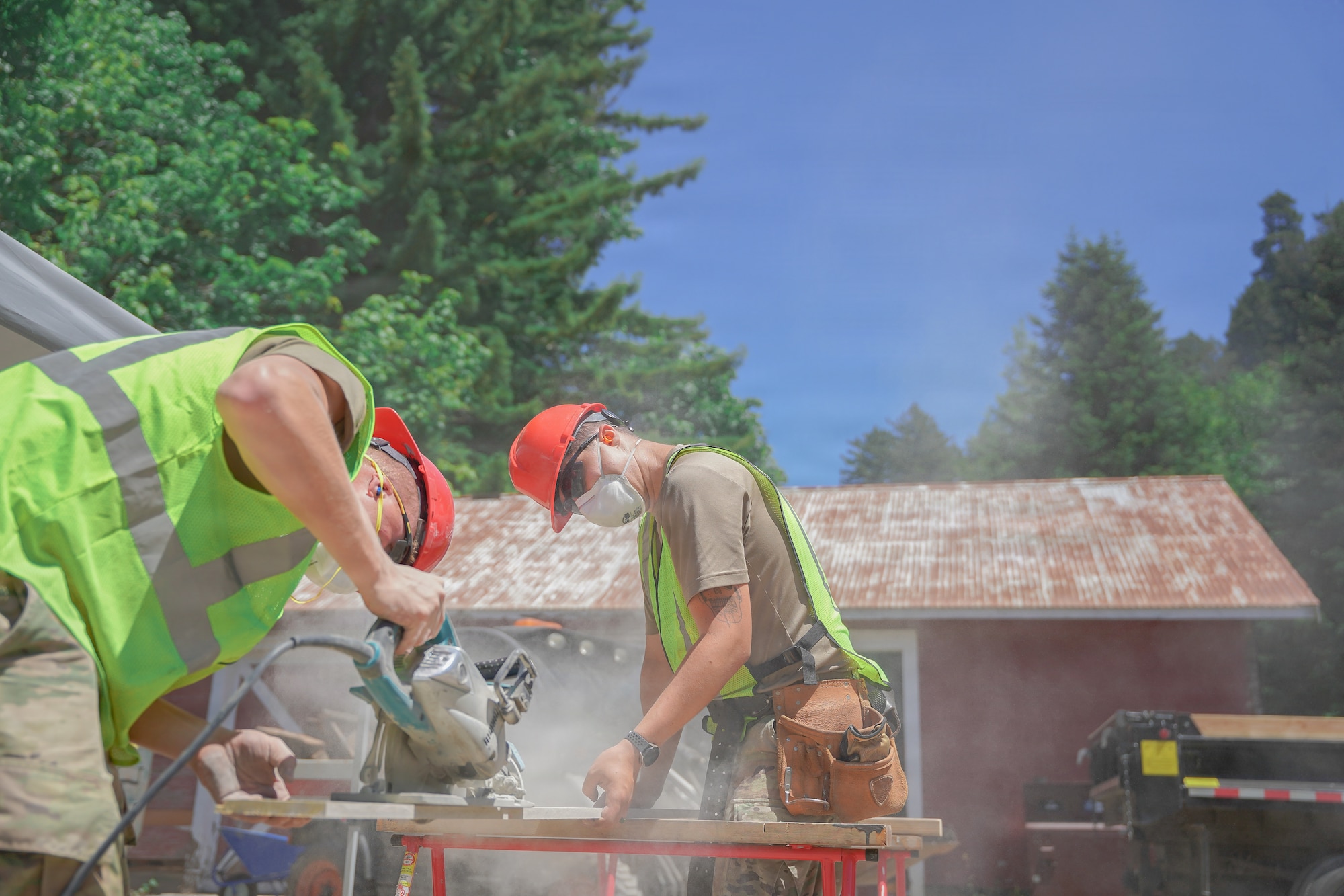 U.S. Air Force Staff Sgt. Dylan Sweigart (left) a structures craftsman, and Airman 1st Class Christopher Lambert, a structures journeyman, both assigned to the 201st Rapid Engineer Deployable Heavy Operational Repair Squadron Engineers, Pennsylvania Air National Guard, fabricate exterior siding at Redwood National and State Parks near Orick, California, July 14, 2026.