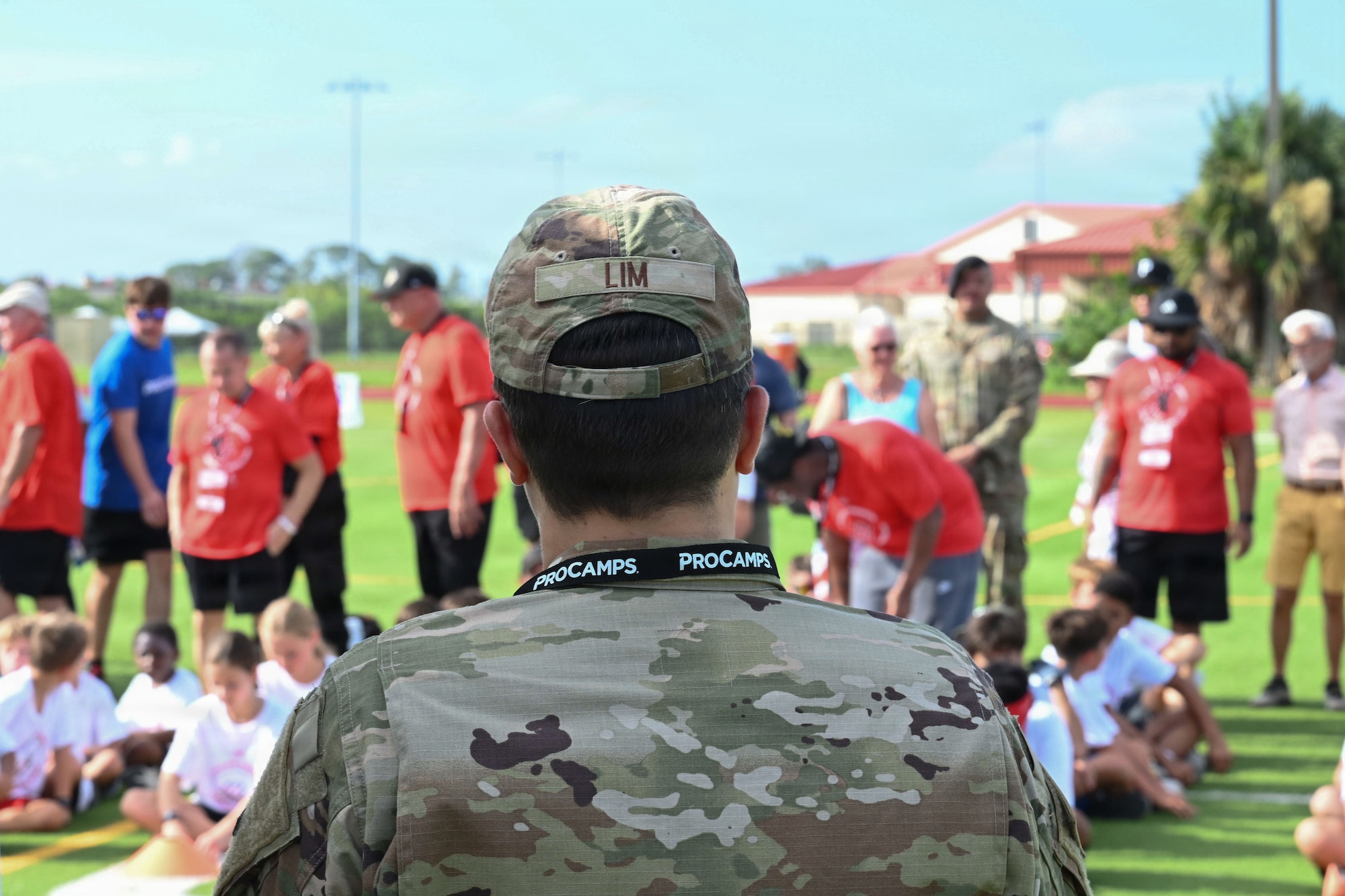 U.S. Air Force Col. BJ Lim, 6th Mission Support Group commander, prepares to give opening remarks at the NFL Football Procamp hosted on MacDill Air Force Base, Florida, July 25, 2026. The football camp was hosted by A’Shawn Robinson, Tampa Bay Buccaneers defensive end, to support local military families and provide fundamental coaching. (U.S. Air Force photo by Airman 1st Class Alexis McDonnell)