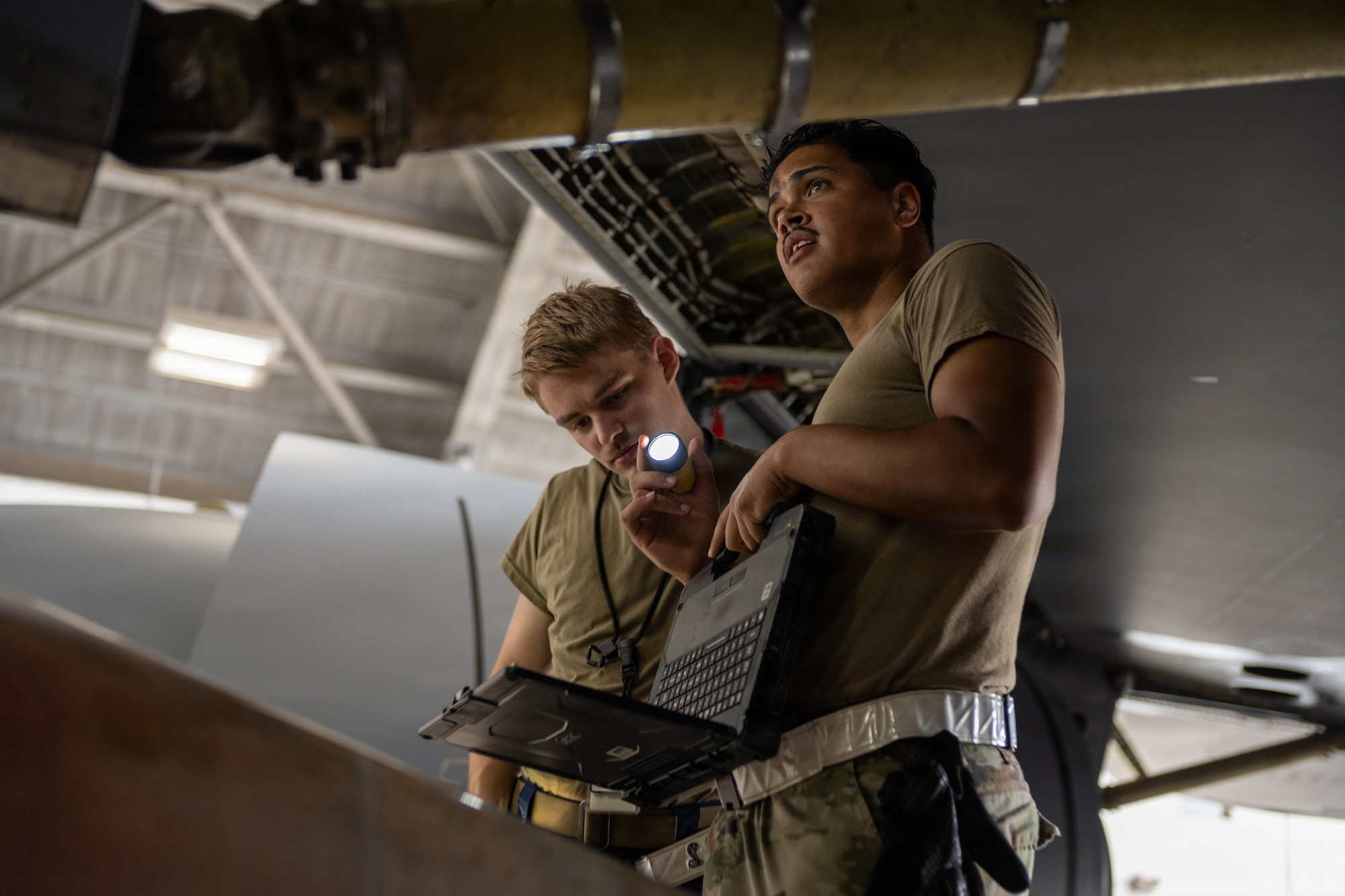 U.S. Air Force Airman 1st Class Nathaniel Wilson, left, and Airman 1st Class Aaron Purnell, both 6th Maintenance Squadron isochronal (ISO) inspection journeymen, perform an ISO inspection on a KC-135 Stratotanker at MacDill Air Force Base, Florida, July 29, 2026. ISO inspections require maintainers to access internal and structural areas not normally visible during routine maintenance to identify potential issues and ensure aircraft safety and mission readiness. (U.S. Air Force photo by Senior Airman Derrick Bole)