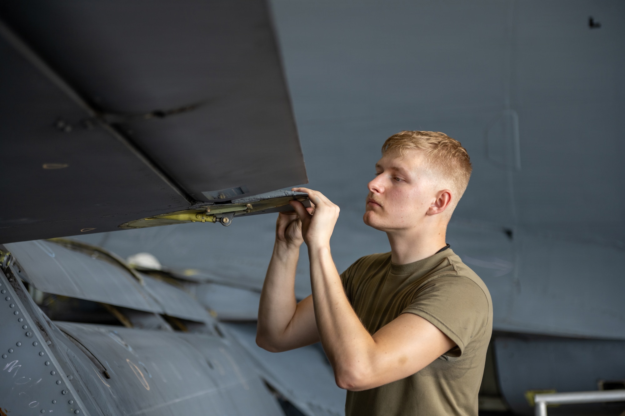 U.S. Air Force Airman 1st Class Jack Cin, 6th Maintenance Squadron isochronal inspection journeyman, inspects the wing of a KC-135 Stratotanker at MacDill Air Force Base, Florida, July 29, 2026. Isochronal inspection Airmen, perform routine preventative maintenance on aircraft to maintain its integrity and readiness. (U.S. Air Force photo by Senior Airman Derrick Bole)