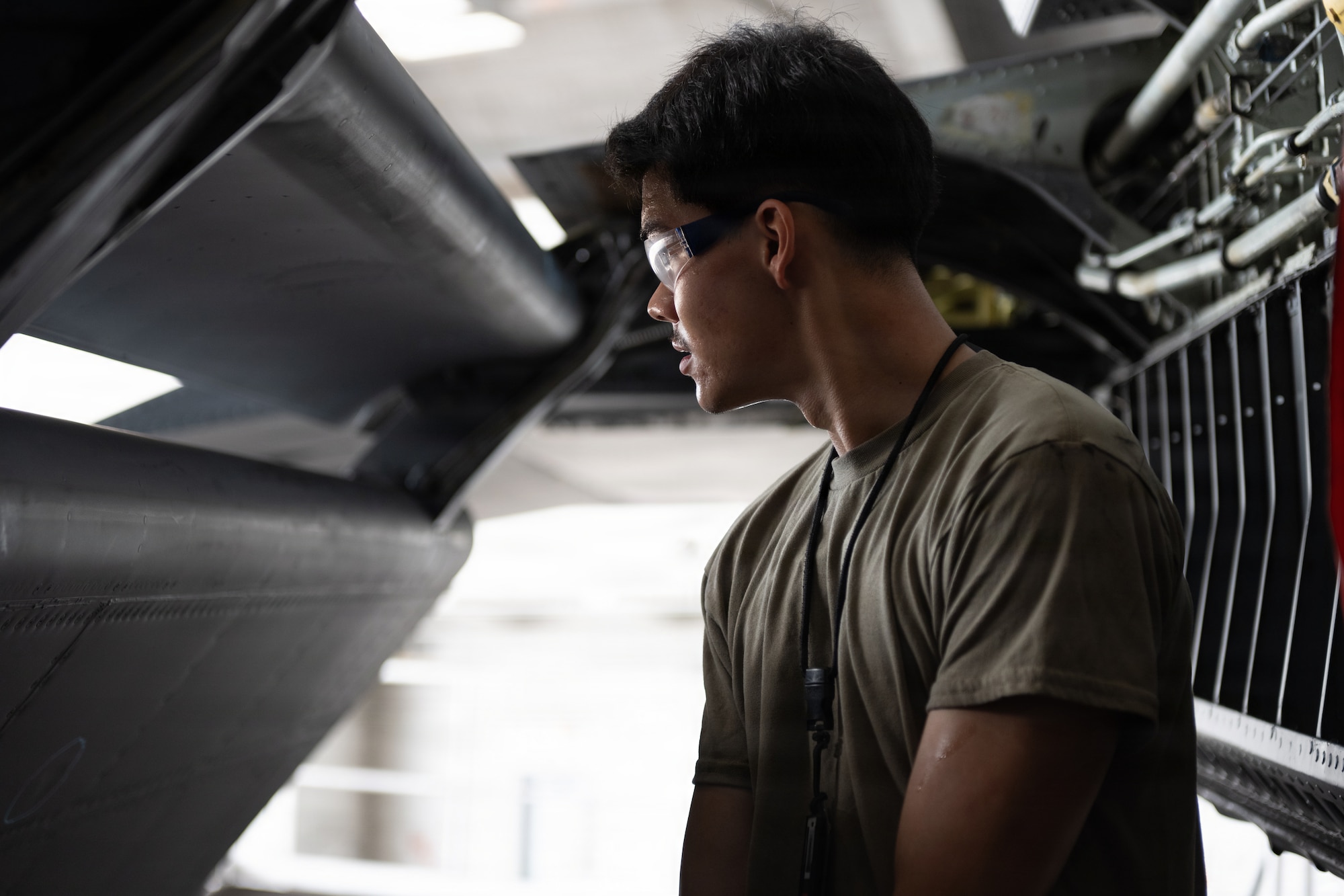 U.S. Air Force Airman 1st Class Rik Romo, 6th Maintenance Squadron isochronal (ISO) inspection journeyman, inspects the integrity of a KC-135 Stratotanker’s wing at MacDill Air Force Base, Florida, July 29, 2026. ISO inspections require maintainers to access internal and structural areas not normally visible during routine maintenance to identify potential issues and ensure aircraft safety and mission readiness. (U.S. Air Force photo by Senior Airman Derrick Bole)