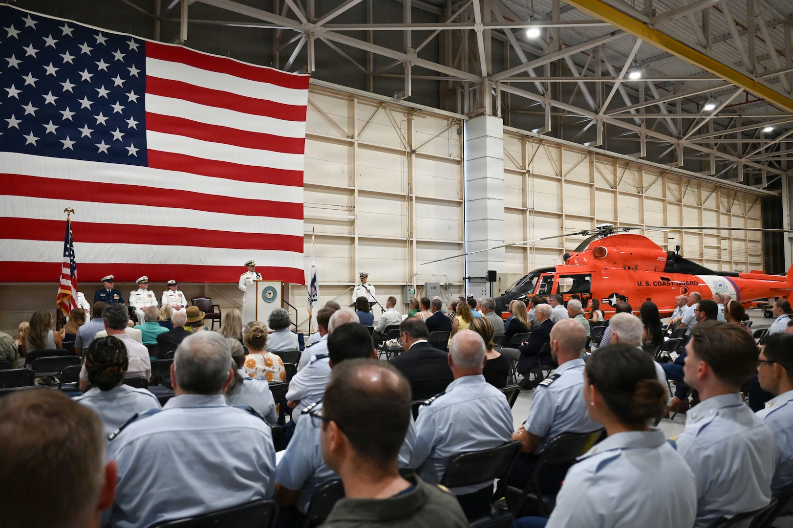 Coast Guard Rear Adm. Adam Chamie, commander, Southeast Coast Guard District, delivers remarks during a change-of-command ceremony held at Air Station Savannah, Georgia, July 31, 2026. During the ceremony, Capt. Maegan Schwartz transferred command of Air Station Savannah to Cmdr. Zachary Wiest. (U.S. Coast Guard photo by Petty Officer 1st Class Brandon Hillard)