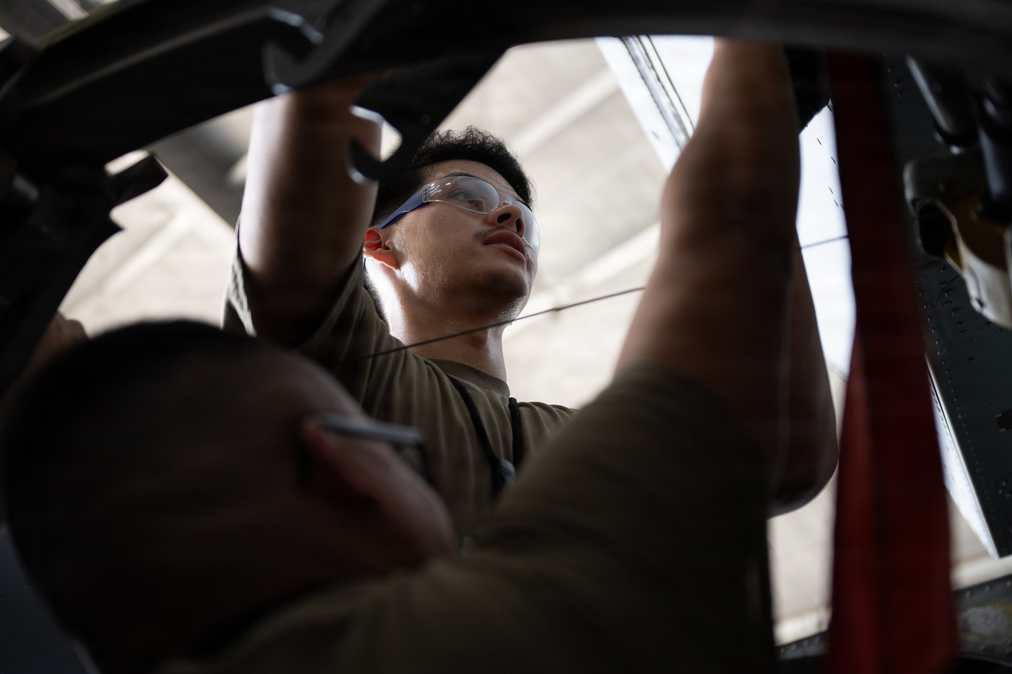 U.S. Air Force Airman 1st Class Rik Romo, 6th Maintenance Squadron isochronal (ISO) inspection journeyman, inspects the integrity of a KC-135 Stratotanker’s wing at MacDill Air Force Base, Florida, July 29, 2026. ISO inspections require maintainers to access internal and structural areas not normally visible during routine maintenance to identify potential issues and ensure aircraft safety and mission readiness. (U.S. Air Force photo by Senior Airman Derrick Bole)