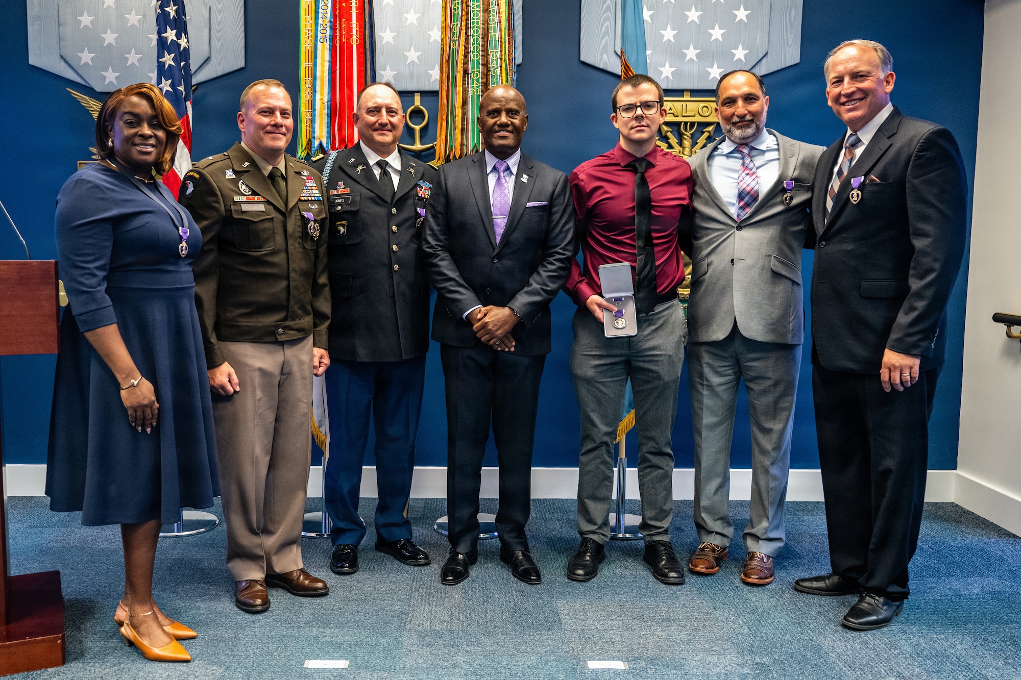 Purple Heart honorees pose for a picture during a ceremony.