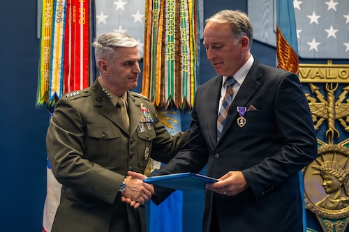Retired officer receiving the Purple Heart during a ceremony.