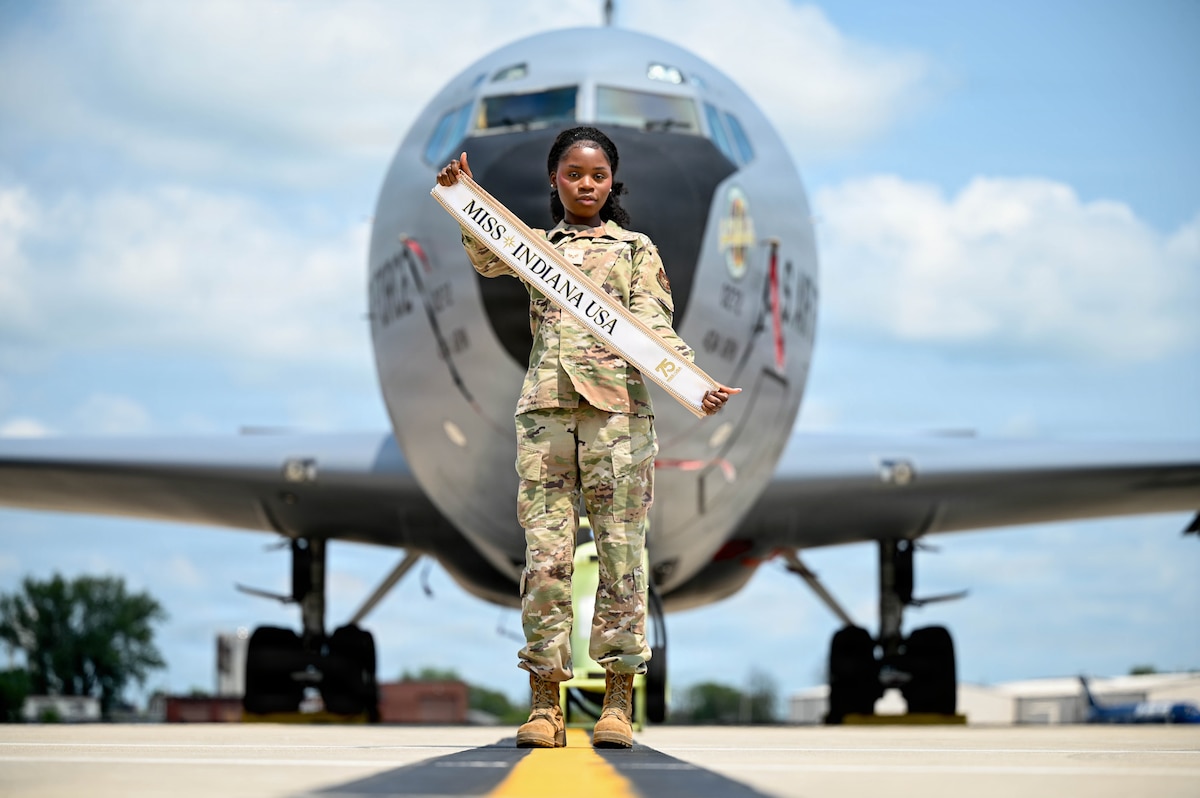 SrA Oke poses in front of an aircraft