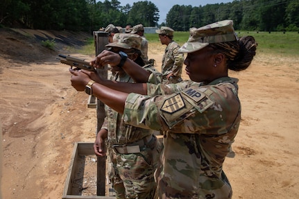 (From left) U.S. Army Spc. Wytega Williams and Pfc. Quiana Tiggle, military police with the 273rd Military Police Company, 372nd Enhanced Military Battalion, 260th Special Purpose Brigade, practice proper weapons handling on the range at Fort A.P. Hill, Virginia, July 29, 2026. This training was part of a multi-day advanced marksmanship exercise focused on enhancing individual and team weapons proficiency while preparing soldiers for contingency operations.