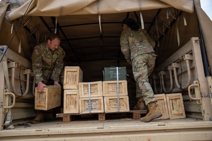 (From left) U.S. Army Cpl. Dustin Arnold and Spc. Kristin Rivera, military police, 273rd Military Police Company, 372nd Enhanced Military Battalion, 260th Special Purpose Brigade, unload ammunition on a range during training at Fort A.P. Hill, Virginia, July 29, 2026. This training was part of a multi-day advanced marksmanship exercise focused on enhancing individual and team weapons proficiency while preparing soldiers for contingency operations.
